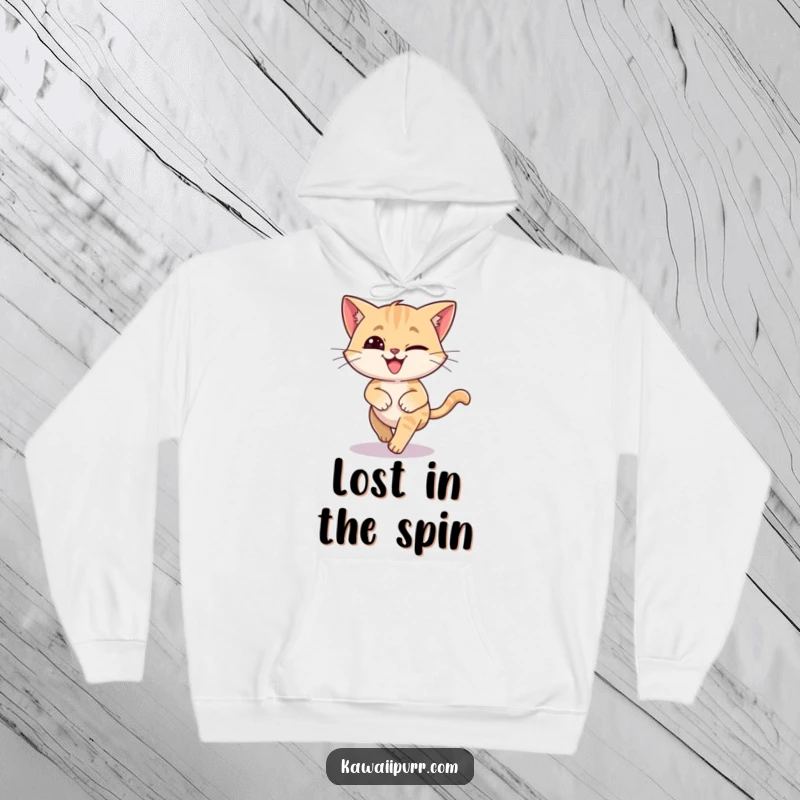 Funny hoodie depicting a silly cat in a dizzy circle, chasing its tail with a hilariously wide grin.