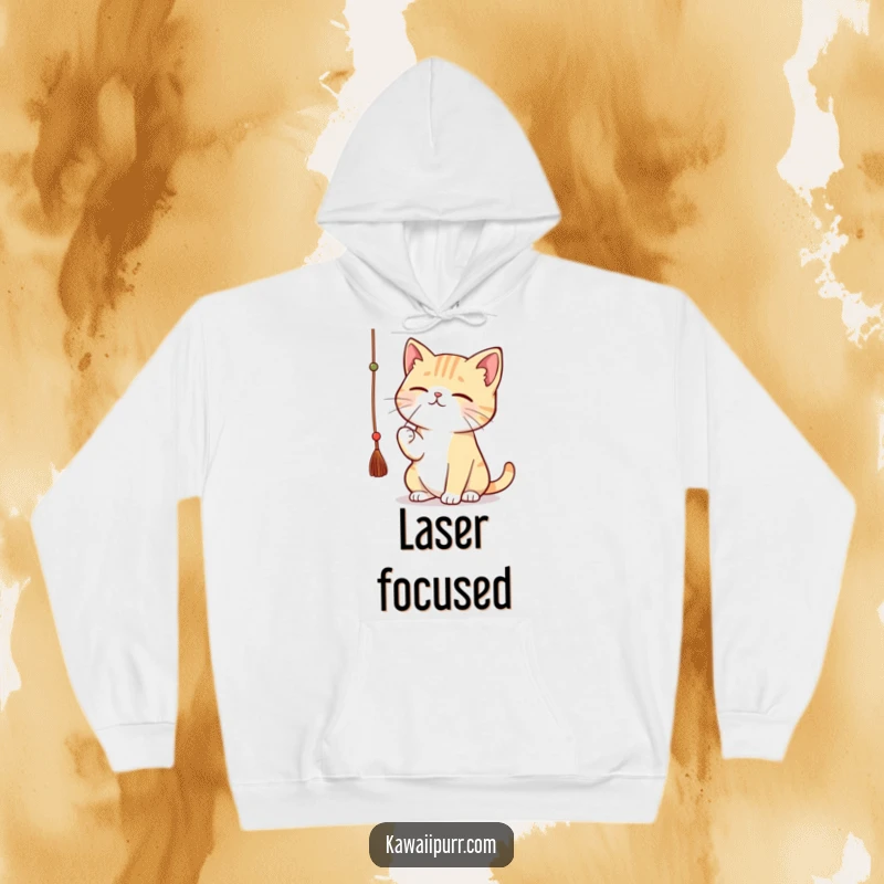 Funny kawaii cat batting a dangling string with great concentration, cozy in a hoodie.
